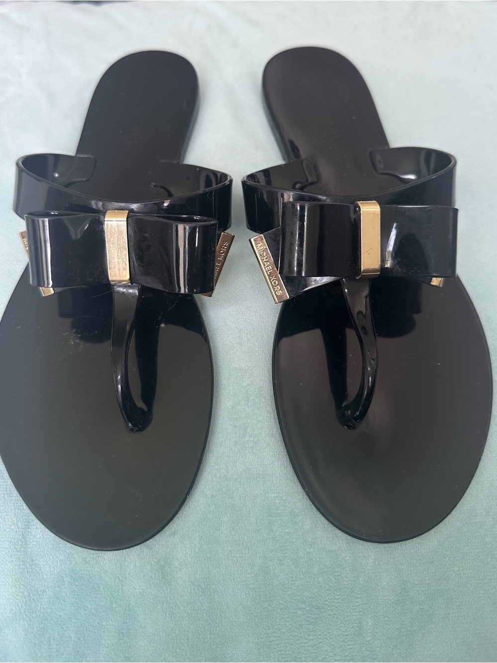 Michael Kors Black Jelly Bow Thong Sandals with Gold Accents